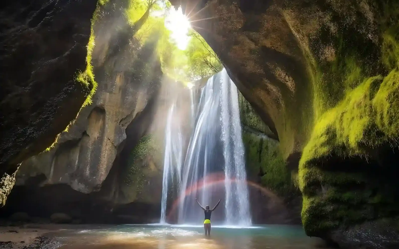 Sun rays inside Tukad Cepung waterfall cave, Bali