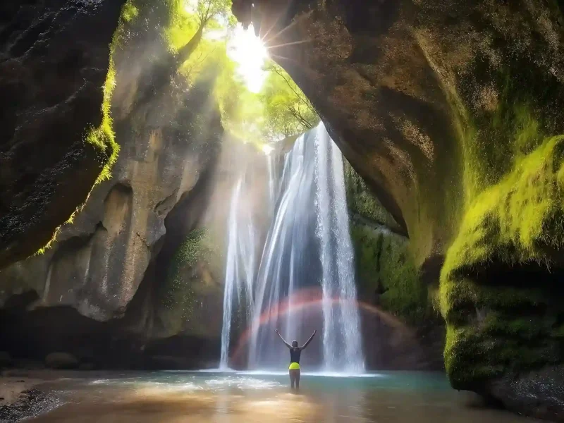 Sun rays inside Tukad Cepung waterfall cave, Bali